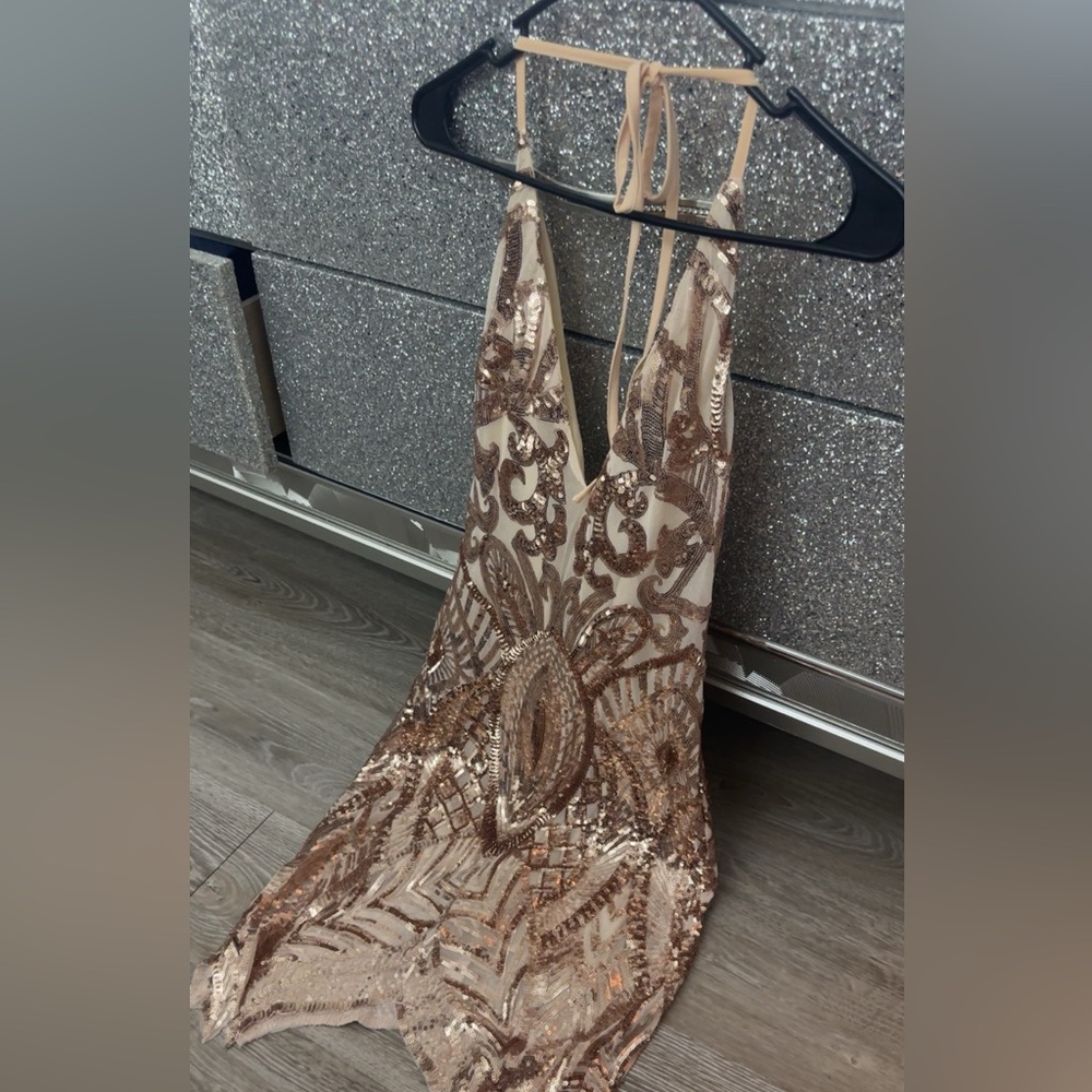 This is a rose gold dress. Short up to your knees dress. Only wore once